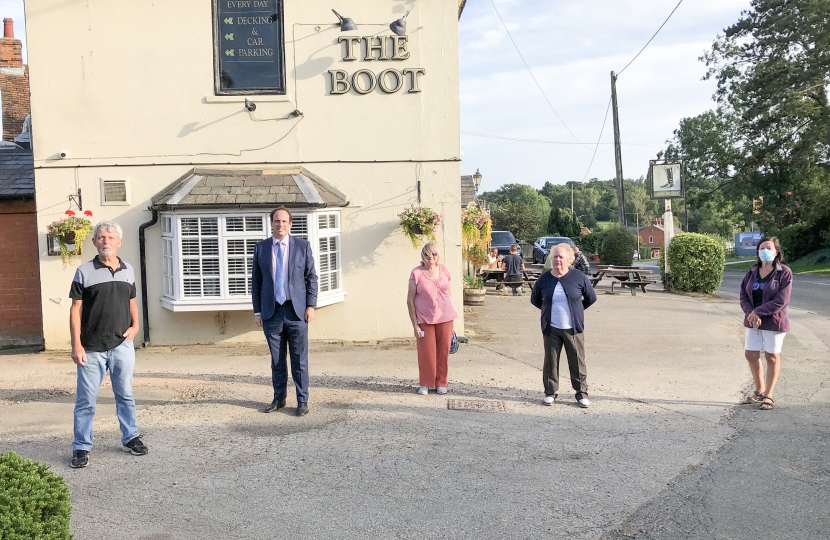 Greg with residents outside The Boot pub.