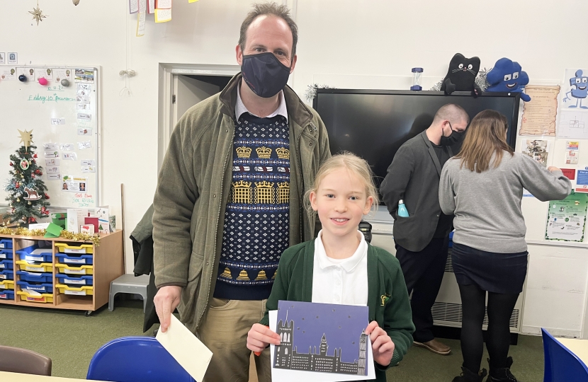 Greg with 2021 MPs Christmas Card Competition Winner, Florrie.